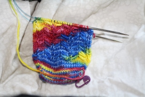 The socks are a great example of pulling, but it works because it makes a spiral. The only thing I'm kind of concerned about is that I am afraid that the pattern is getting over shadowed by the pooling.